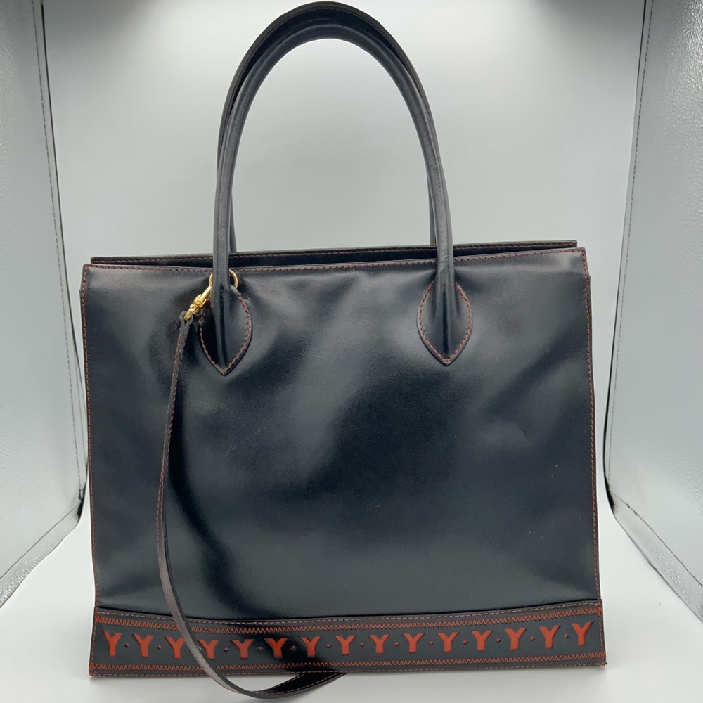 Vintage YSL tote, black with red Y motif cutouts!